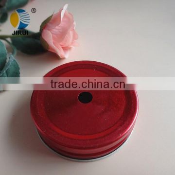 red screw metal cap with a hole for drinking jar