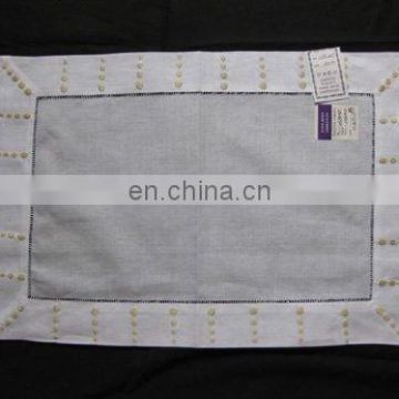 linen placemat with embroidery and ladder hemstitch