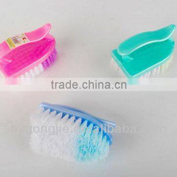 small plastic clothing brush