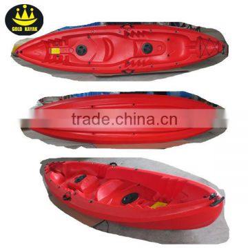 red family kayak with fishing rod holder