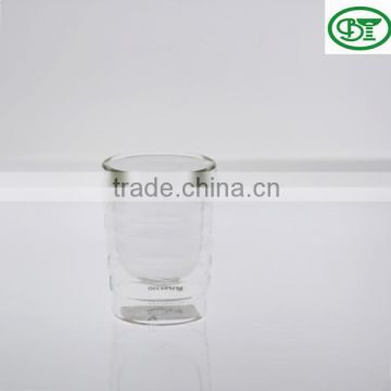 clear glass tea cup with thwartwise line