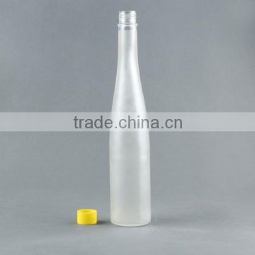 frosted glass beverage bottle