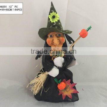Straw and fabric scarecrow witch for halloween decoration
