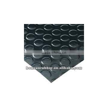 Studded rubber floor mat