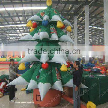 green snowing inflatable christmas tree