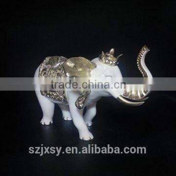 White and golden resin elephant statue