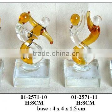 yellow and clear glass figures decoration