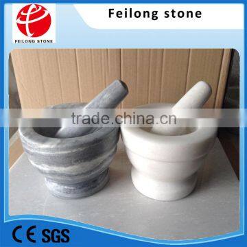 white marble mortar and pestle