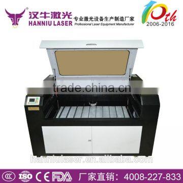 Guangzhou Hanniu 1300*900mm UD-1390 co2 laser paper cutting machine with up and down table