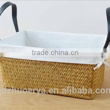 basket made of natural straw seagrass for housewaring with handle and lining