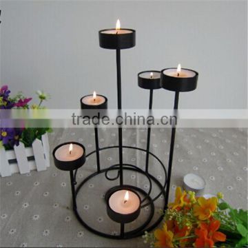 large black metal chandelier with many candle holders