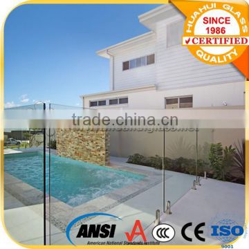 custom frameless glass swimming pool fence with spigot design