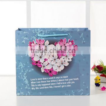factory price blue Gift paper Packaging Bag with handlle for shopping wtih beautiful flowers