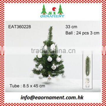 Set of silver hanging balls and small artificial christmas tree