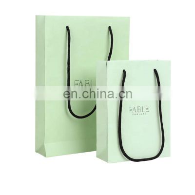 Wholesale custom logo clothing shopping bag packaging gift white kraft paper bag with rope hande