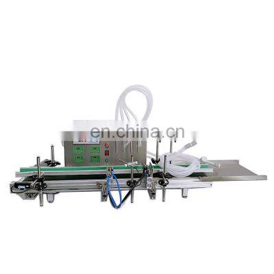 High Production Four Heads Desktop Automatic Liquid Filling Machine With Conveyor Belt For Small Business