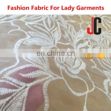 Shaoxing textile 100% polyester embroidery lace fabric with hole wholesale