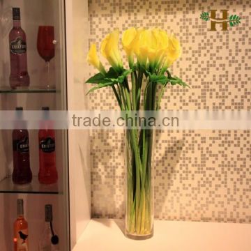 Handmade cylinder shape clear glass vase with flower arrangement