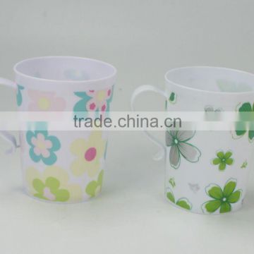 Plastic cup with handle with flower design