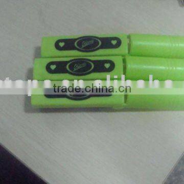 green handle with black printing washable lint roller