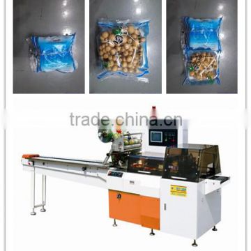 Edible mushrooms in tray reciprocating wrapping machine