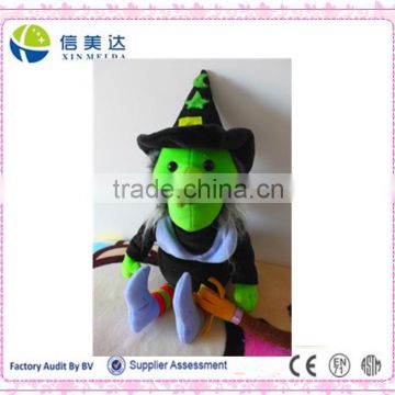 Plush cartoon green witch with a besom toy